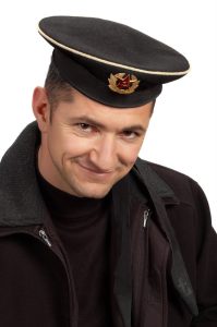 military sailor wearing uniform black cap and jacket